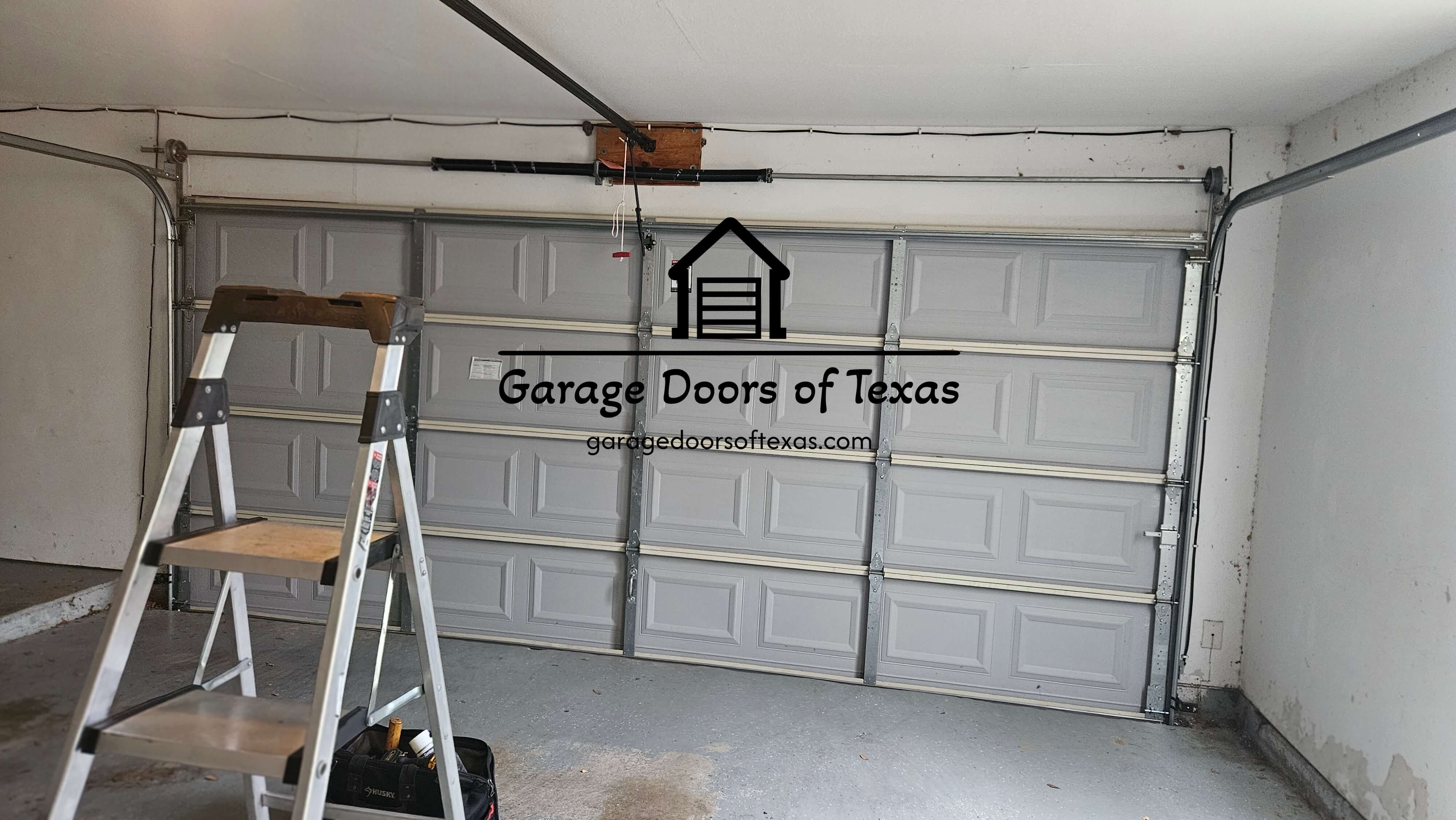 garagedoorsoftexas.com_garage_door_torsion_springs_replacements